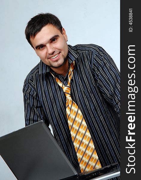Young businessman with laptop computer