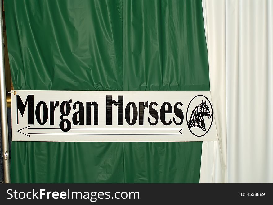 Sign at horse expo pointing to Morgan Horses. Sign at horse expo pointing to Morgan Horses.
