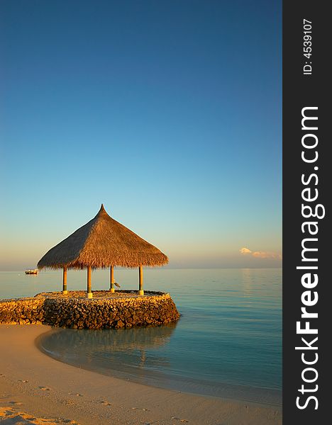 Tropical beach at sunrise on maldives