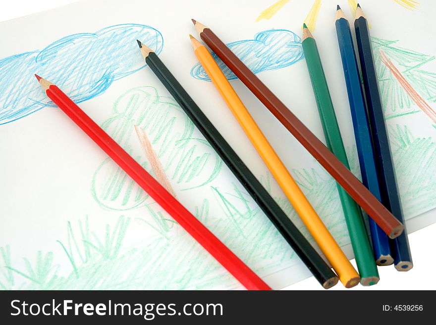Child's drawing and colored pencils (crayons). Child's drawing and colored pencils (crayons).