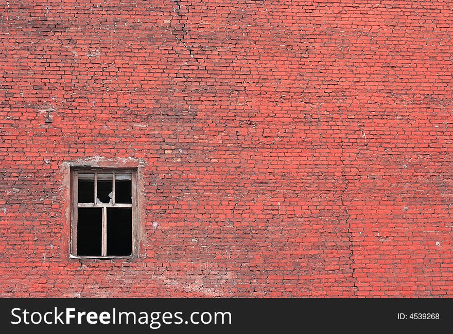 Old urban brick wall with destroyed window. Old urban brick wall with destroyed window.