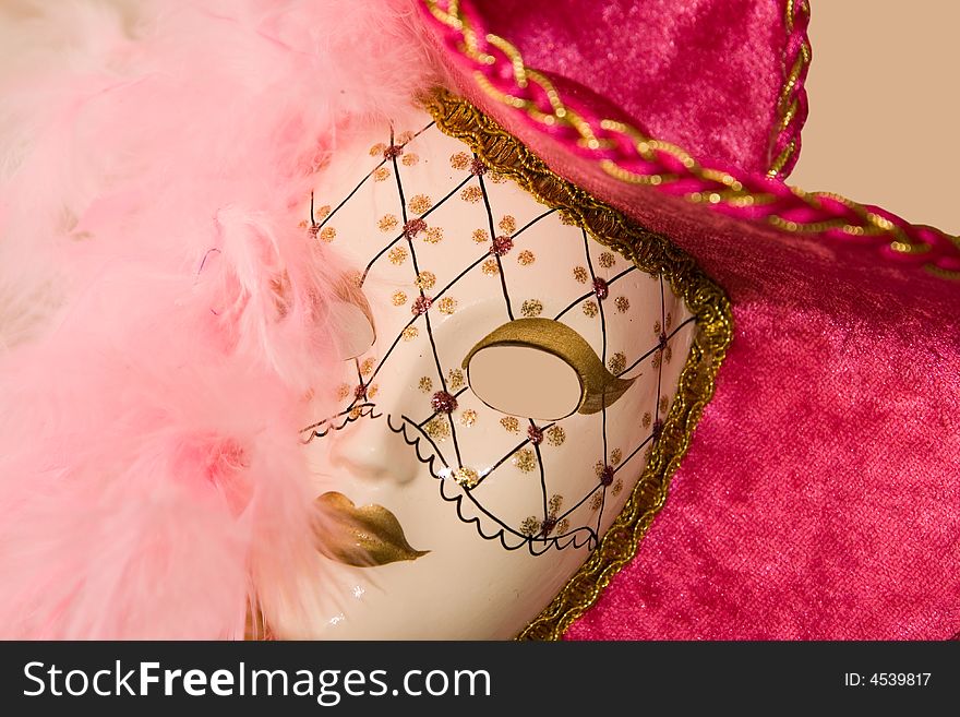 Colorful beautiful carnival mask isolated on beige background