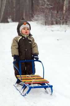 Baby Standing Near Sled Stock Image Baby Standing Near Sled Stock Image