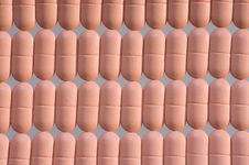 Rows Of Pink Pills Over Grey Royalty Free Stock Images