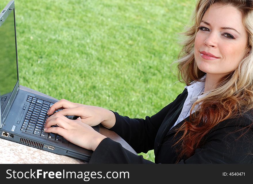 Portrait of a confident and successful businesswoman with a laptop. Portrait of a confident and successful businesswoman with a laptop