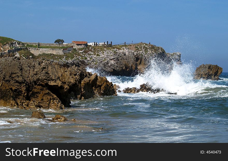 Wave dashing on the cliff nearby Toro Beach. Wave dashing on the cliff nearby Toro Beach