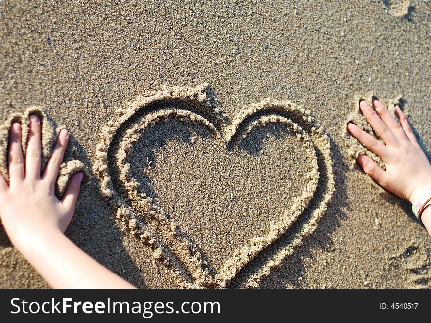 Heart figure drawn on the beach depicting love. Heart figure drawn on the beach depicting love