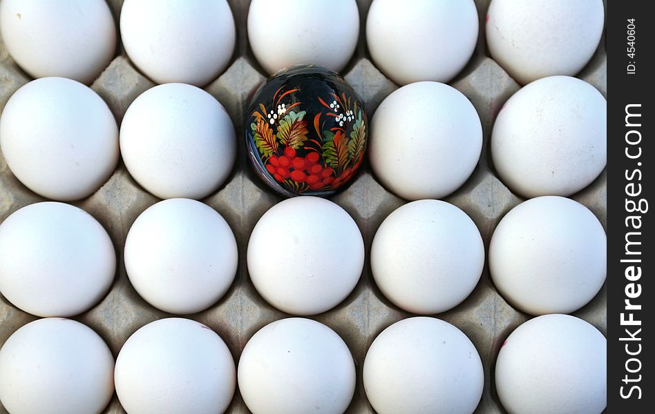 Background of eggs group with one painted egg. Background of eggs group with one painted egg