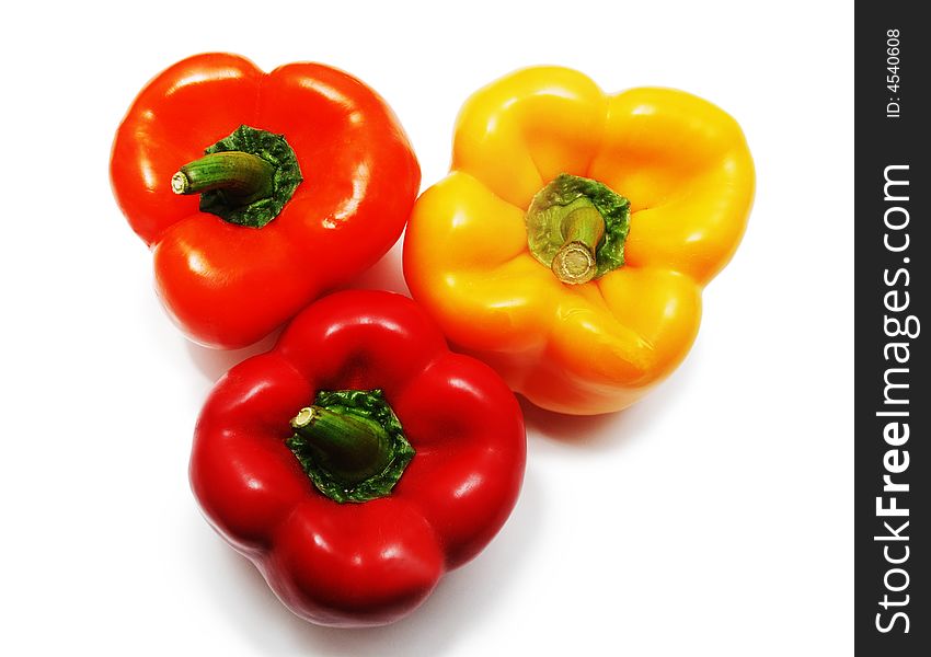 Three peppers red, orange, yellow