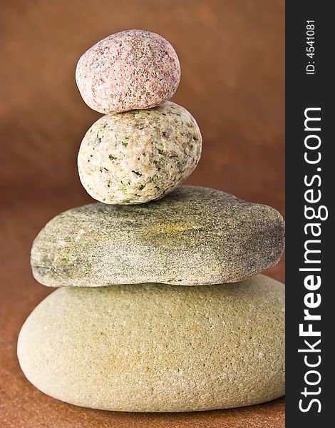 Four stones balancing on each other. Four stones balancing on each other