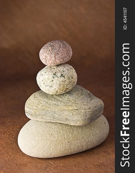 Four stones balancing on each other. Four stones balancing on each other