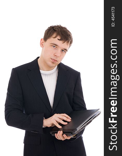 The young businessman with the laptop isolated on a white background