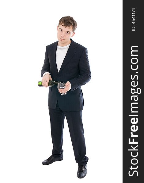 The young businessman with a bottle of wine isolated on a white background. The young businessman with a bottle of wine isolated on a white background