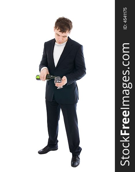 The young businessman with a bottle of wine isolated on a white background. The young businessman with a bottle of wine isolated on a white background