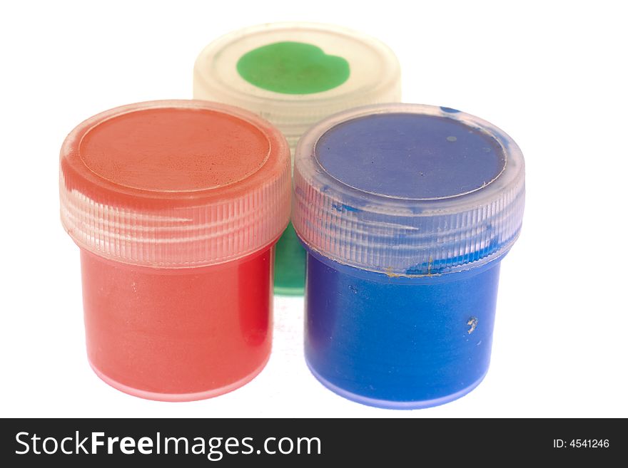 Plastic jars with paint of three colors. Plastic jars with paint of three colors