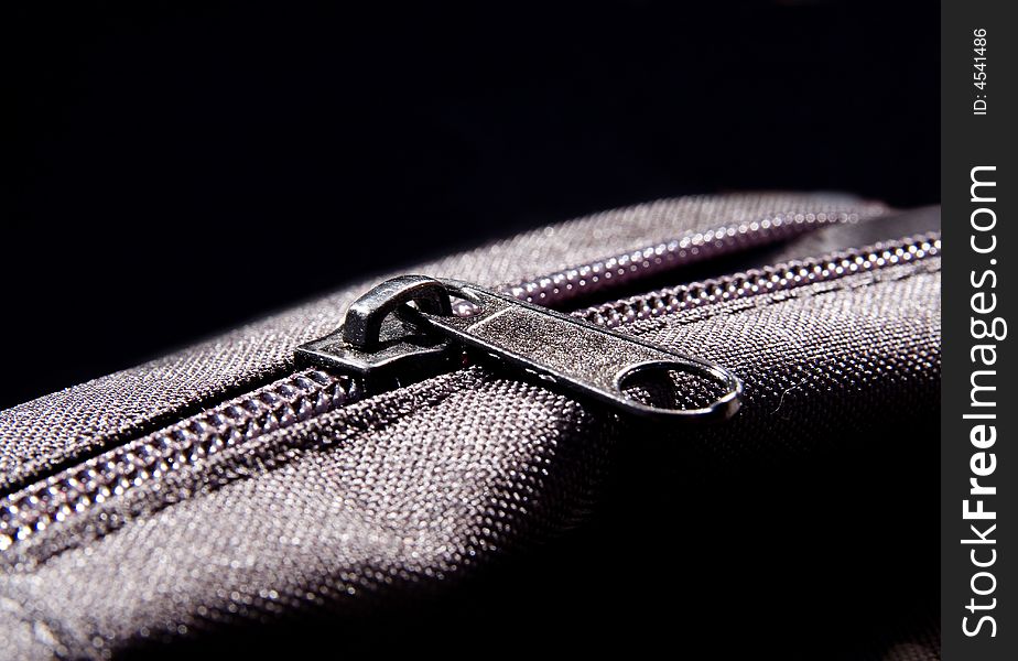 Nylon metal textile zipper on the bag macro