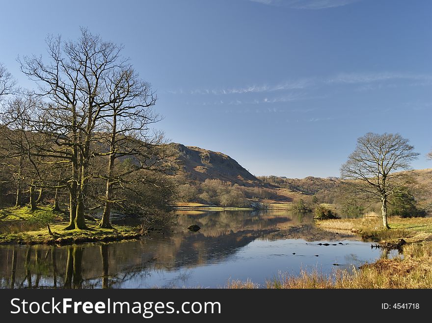 A view of Rydal Water in the English Lake District in early morning sunlight. A view of Rydal Water in the English Lake District in early morning sunlight