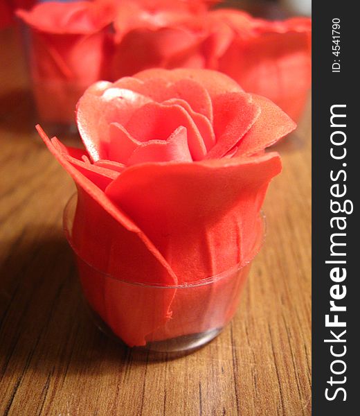 Soap made in image of a rose in a glass cup.