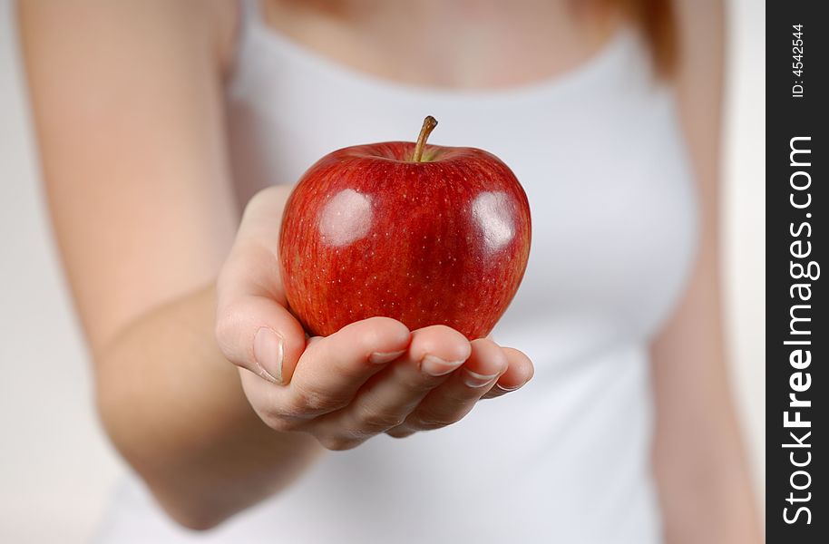 Red apple on beautiful female hand. Red apple on beautiful female hand