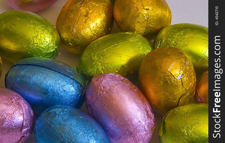 Assortment of multi-coloured chocolate easter eggs. Assortment of multi-coloured chocolate easter eggs