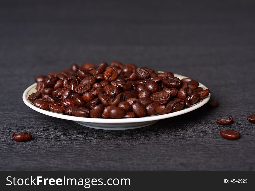 A mineral deposit of coffee is falling coffee grains