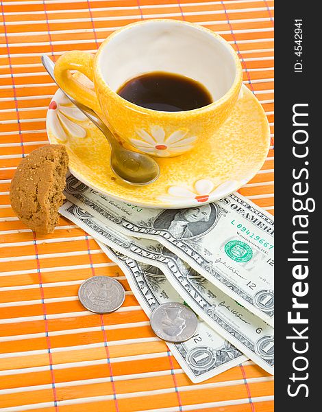 Three dollars and 50 cent pay for coffee and cookies on bamboo table-cloth. Three dollars and 50 cent pay for coffee and cookies on bamboo table-cloth