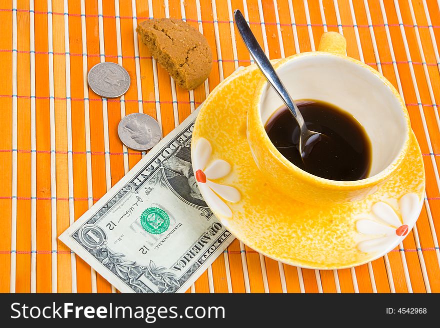 One dollar and 50 cent pay for coffee and cookies on bamboo table-cloth