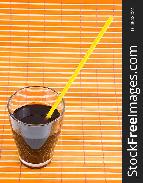 Fresh drink in glass with drinking straw