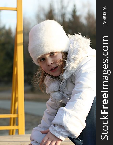 Merry child on playground, springtime