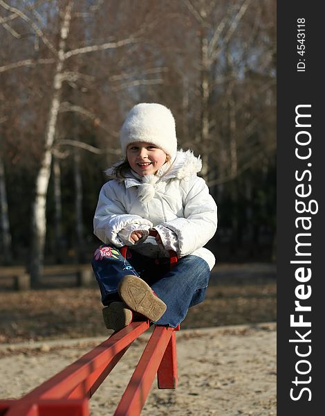 Merry child on playground, springtime