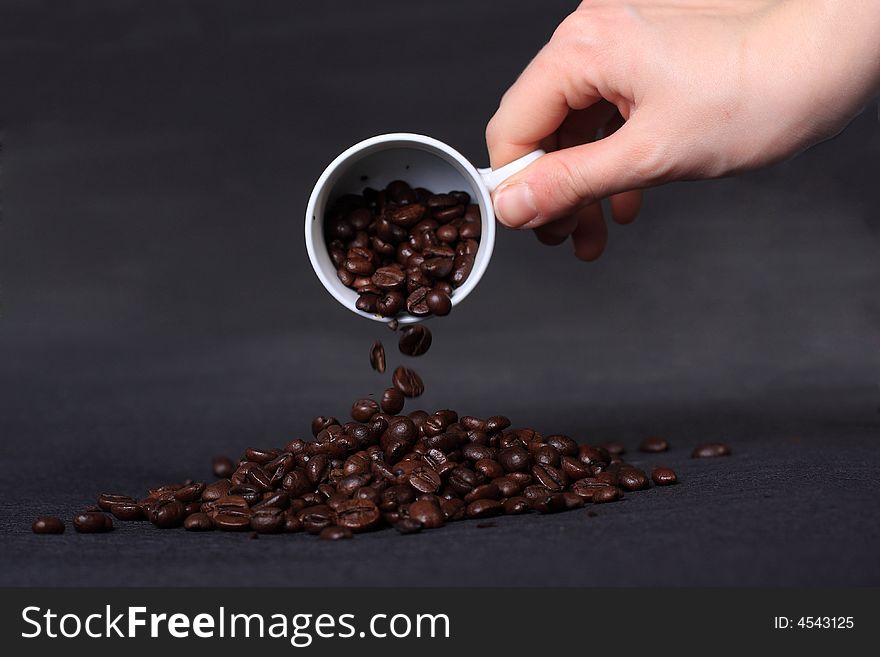 A mineral deposit of coffee is falling coffee grains