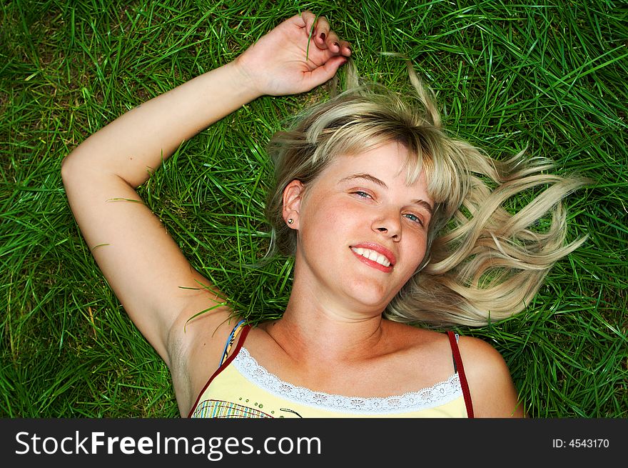 Woman lie on green grass. Woman lie on green grass