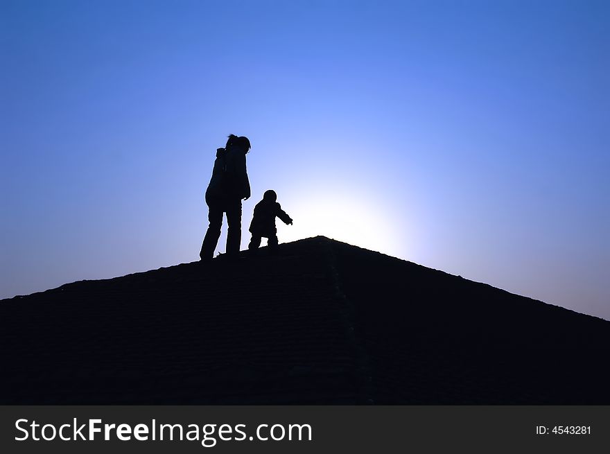 Silhouette of mother with baby