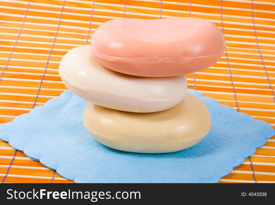 Close-up of soap on the bamboo table-cloth