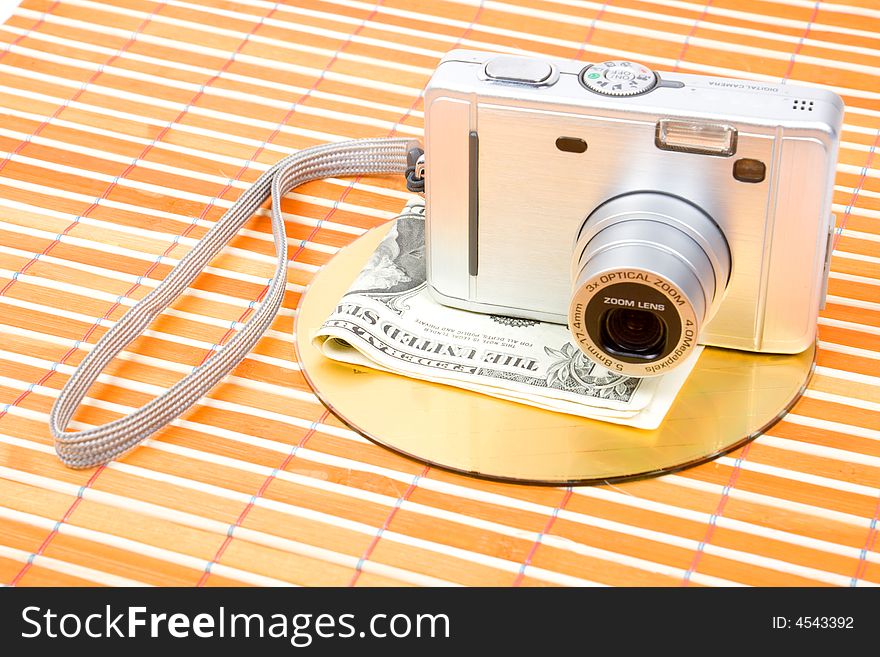 Us money and digital photo camera with dvd disk