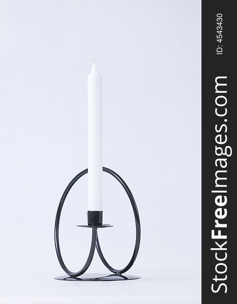 Black steel wound candleholder in simple, modern style