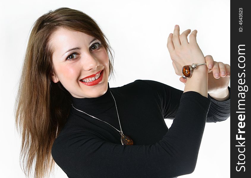Happy laughs girl shows the amber bracelet. Happy laughs girl shows the amber bracelet