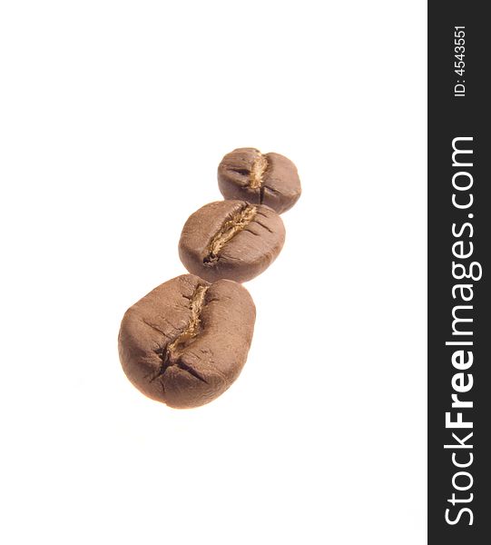 Row of three coffee beans in touch with each other isolated over white. Row of three coffee beans in touch with each other isolated over white