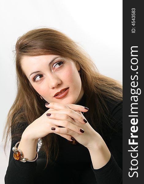 Portrait of a young woman. On the hand the amber bracelet.