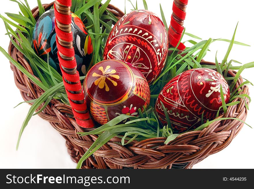 Colored Easter eggs in basket with grass. Colored Easter eggs in basket with grass