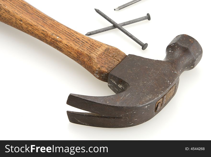 Old vintage hammer and nail for home construction
