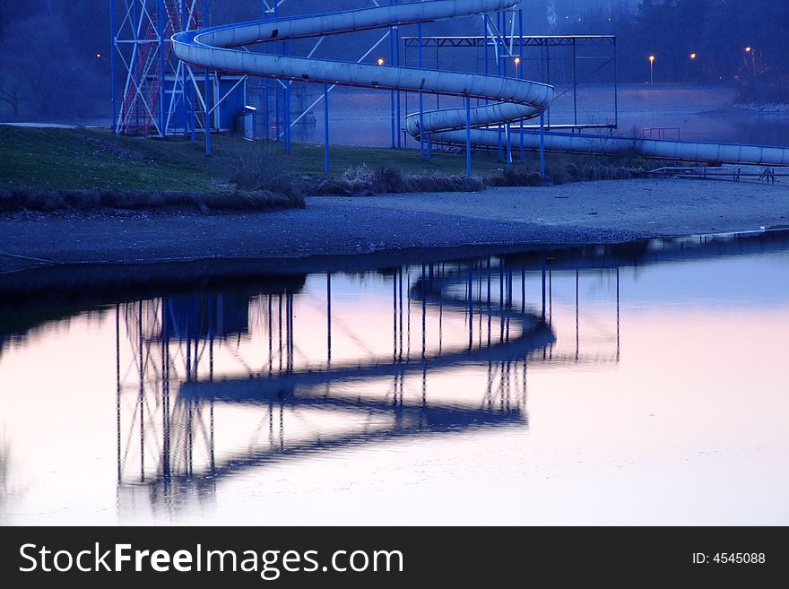 A view of a dam at dusk with reflected slide. A view of a dam at dusk with reflected slide