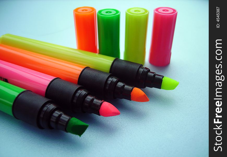 A close detail of a few plastic colored pencils. A close detail of a few plastic colored pencils