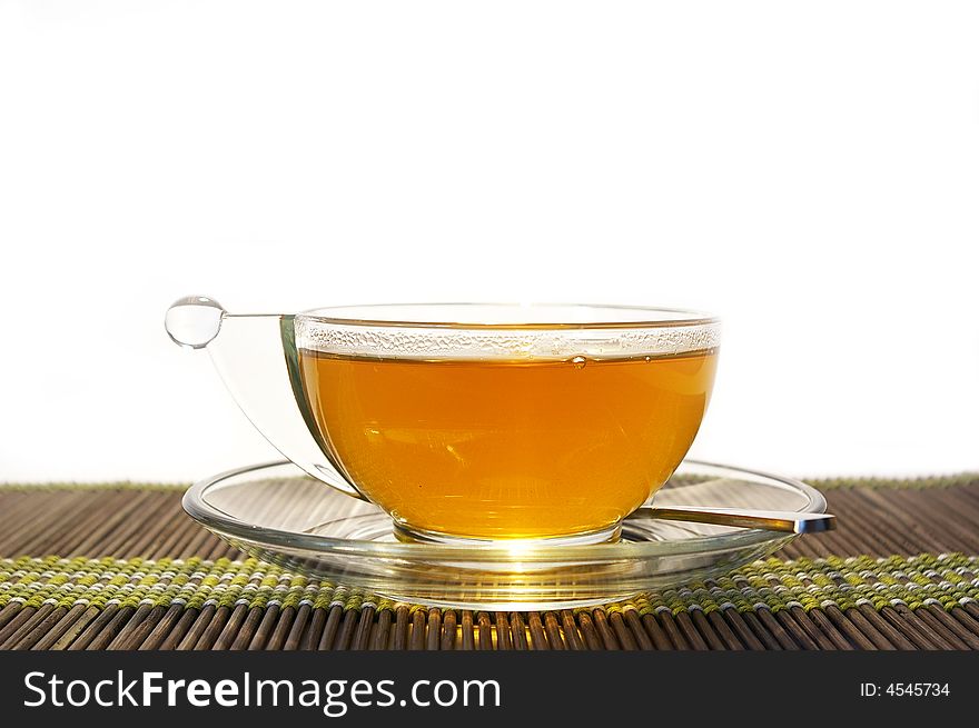 Transparent cup of tea on a white background