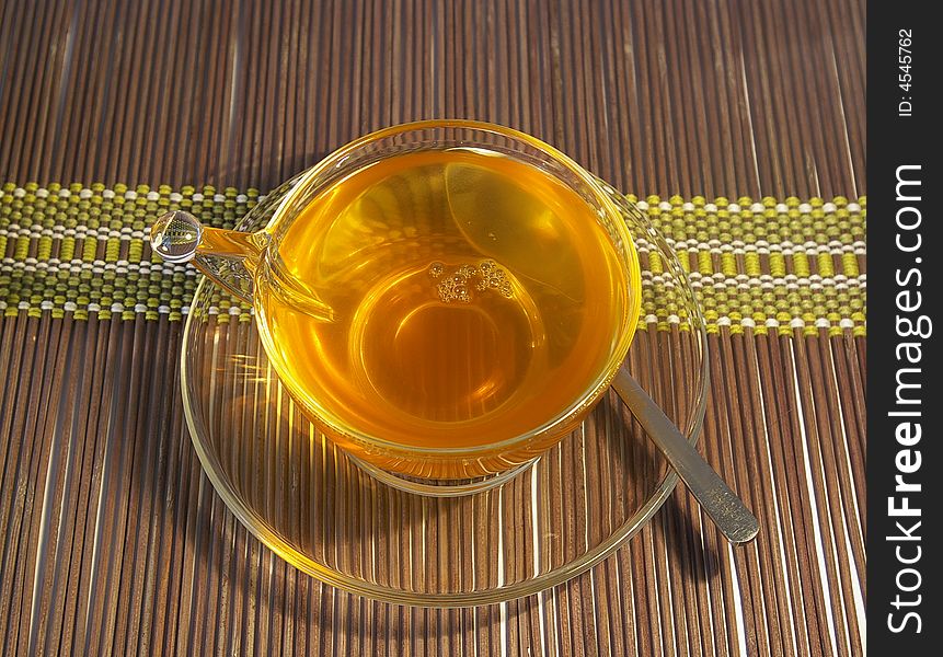 Transparent cup of tea on a white background. Transparent cup of tea on a white background