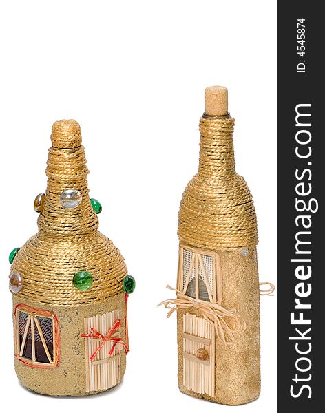 Two golden glasses decorative bottles