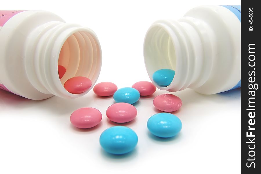 Cyan and magenta pills on a white background