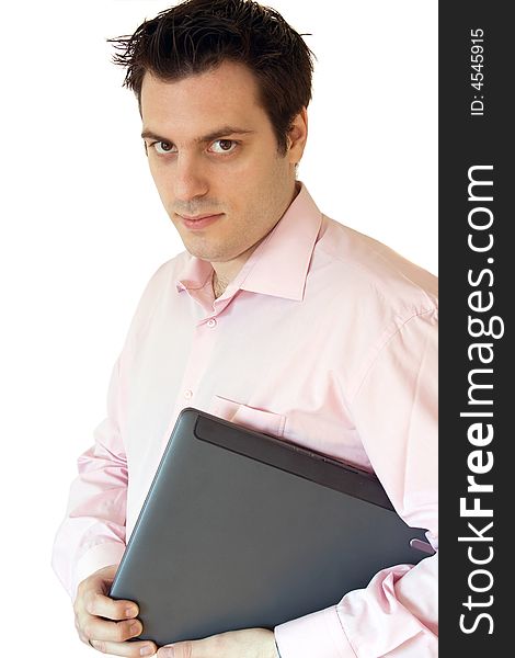 A man, carrying a laptop computer under his arm, smiling. A man, carrying a laptop computer under his arm, smiling
