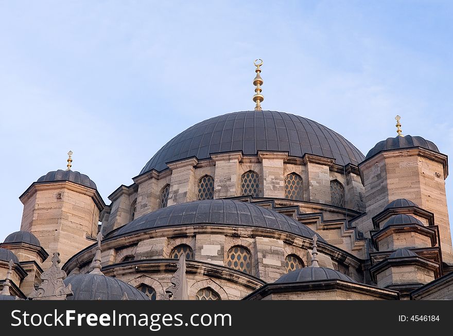 The Yeni Mosque, New Mosque or Mosque of the Valide Sultan (Turkish: 'Yeni Cami, Valide Sultan Camii') (1597 - 1663) is an Ottoman mosque located in the Emin�n� district of Istanbul, Turkey. It is situated on the Golden Horn at the southern end of the Galata Bridge. Together with the Galata Bridge the New Mosque is one of the best-known sights of Istanbul. An elegant fountain for ablutions stands