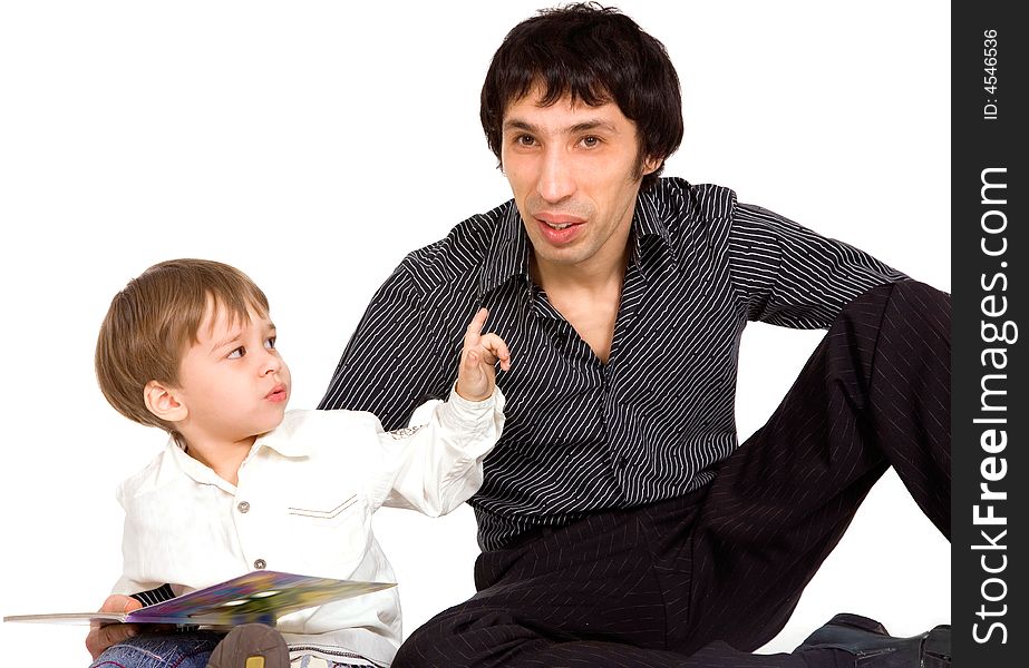 Father and son reading a book over white background
